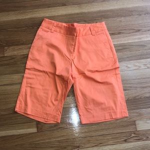 Women’s orange Bermuda shorts